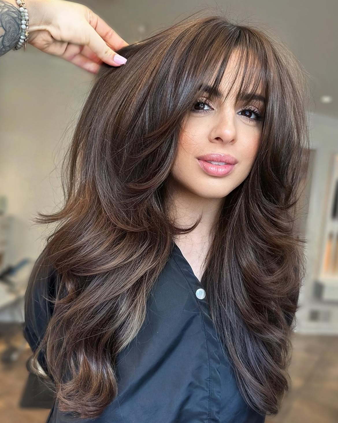 Voluminous Layered Brunette With Textured Curtain Bangs