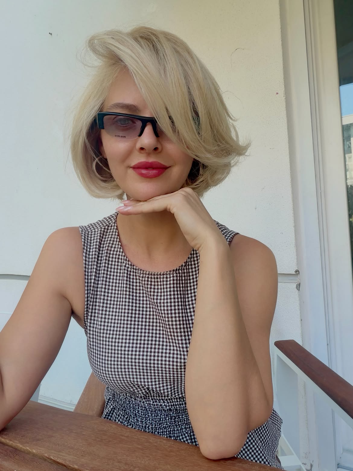 Voluminous Platinum Blonde Bob With Side-Swept Bangs