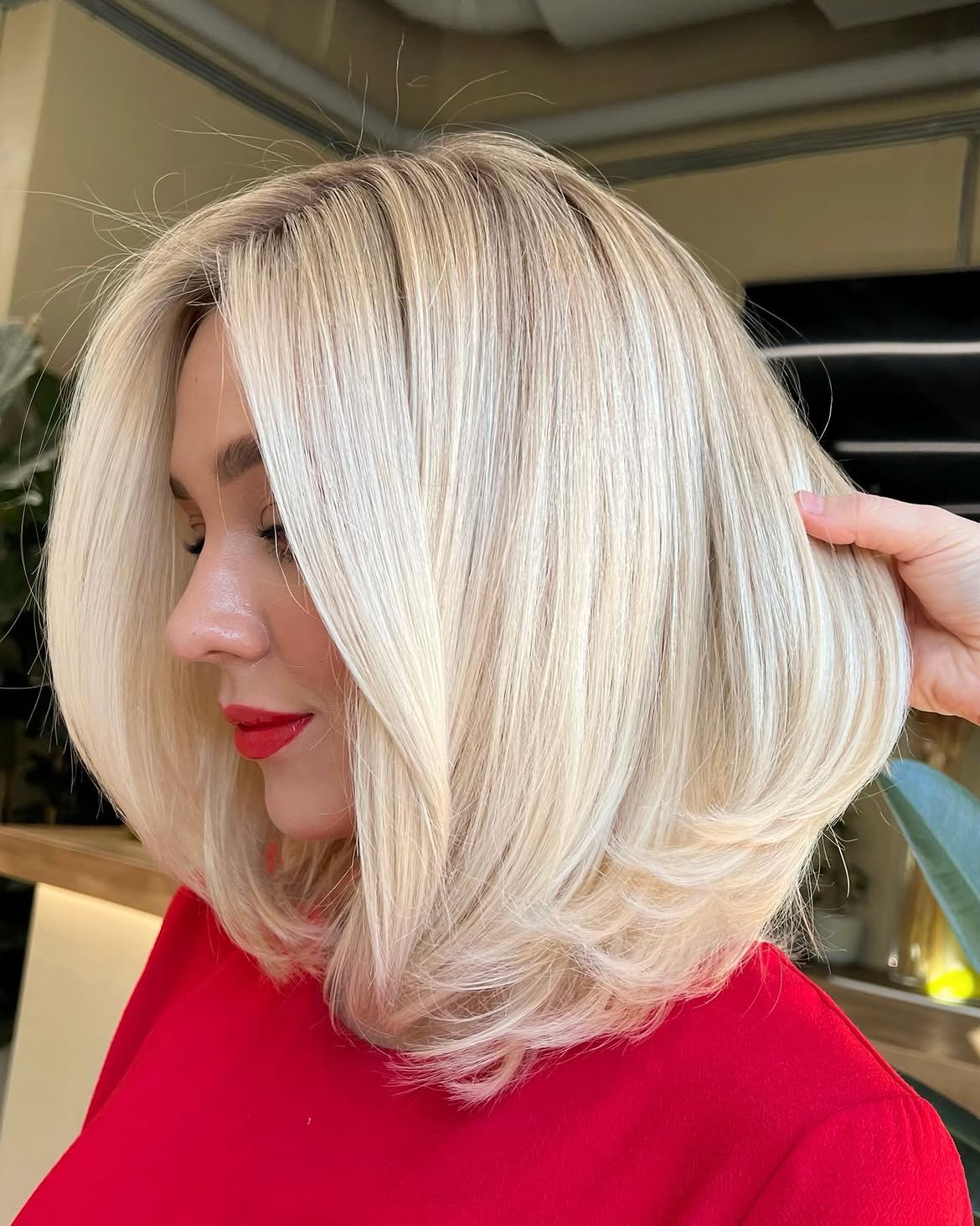 Voluminous Rounded Blowout On Platinum Blonde Lob
