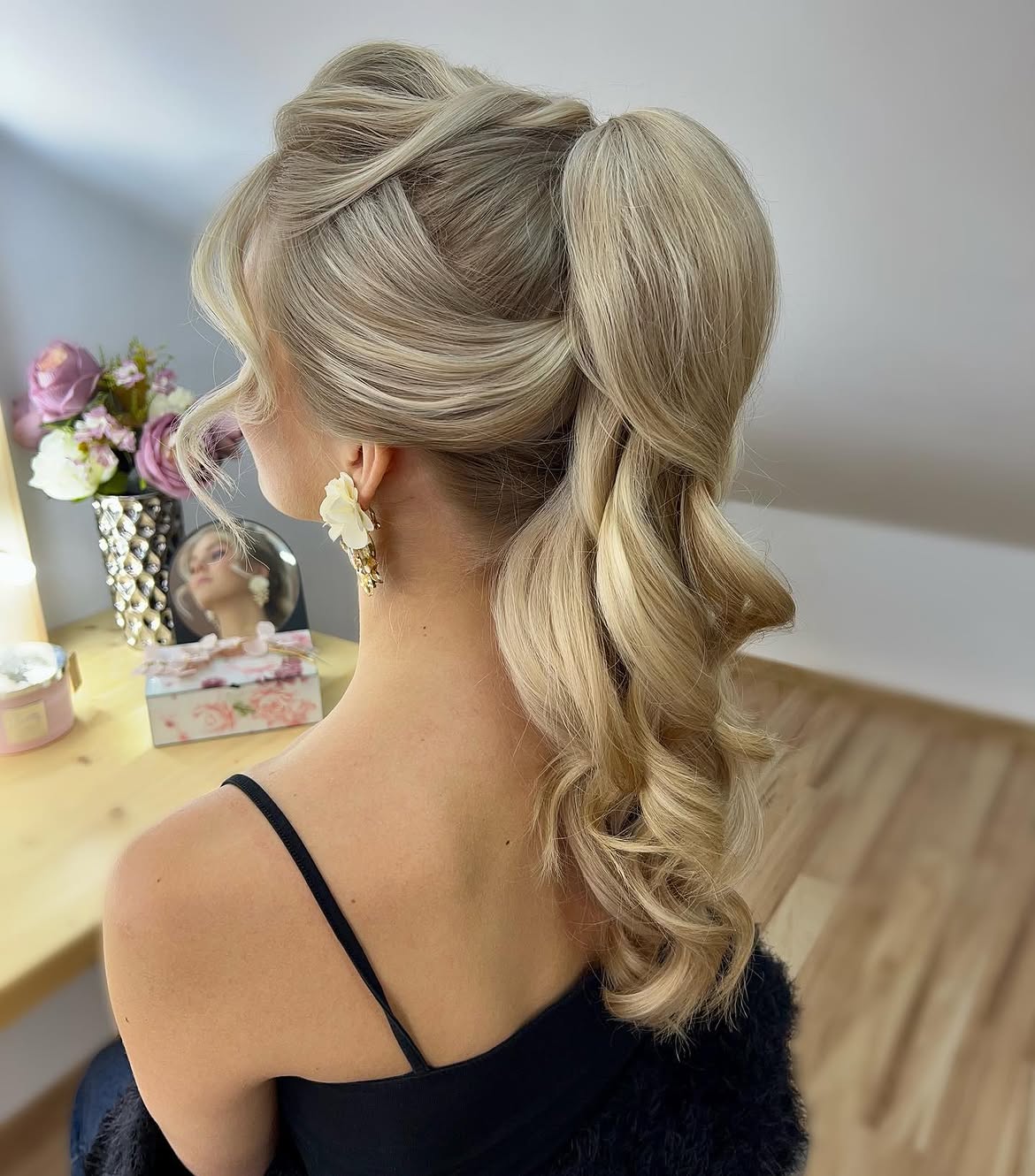 Voluminous Wavy High Ponytail With Face Framing Layers