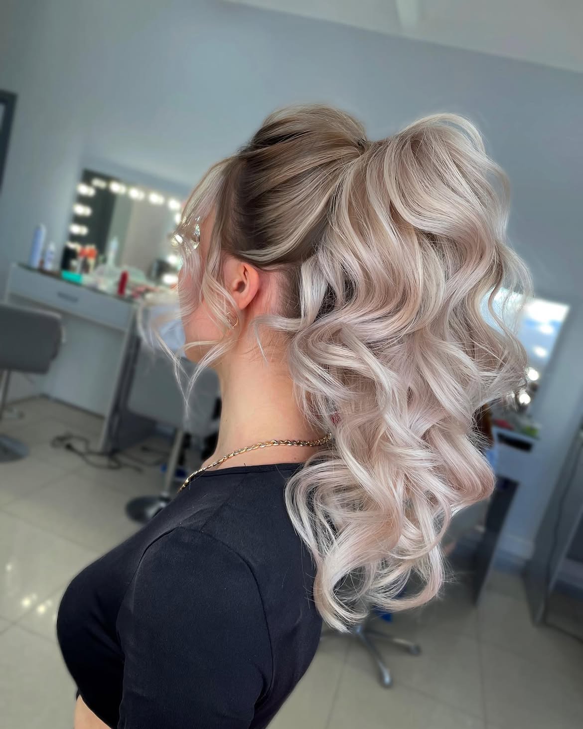 Voluminous Wavy High Ponytail With Face Framing Pieces