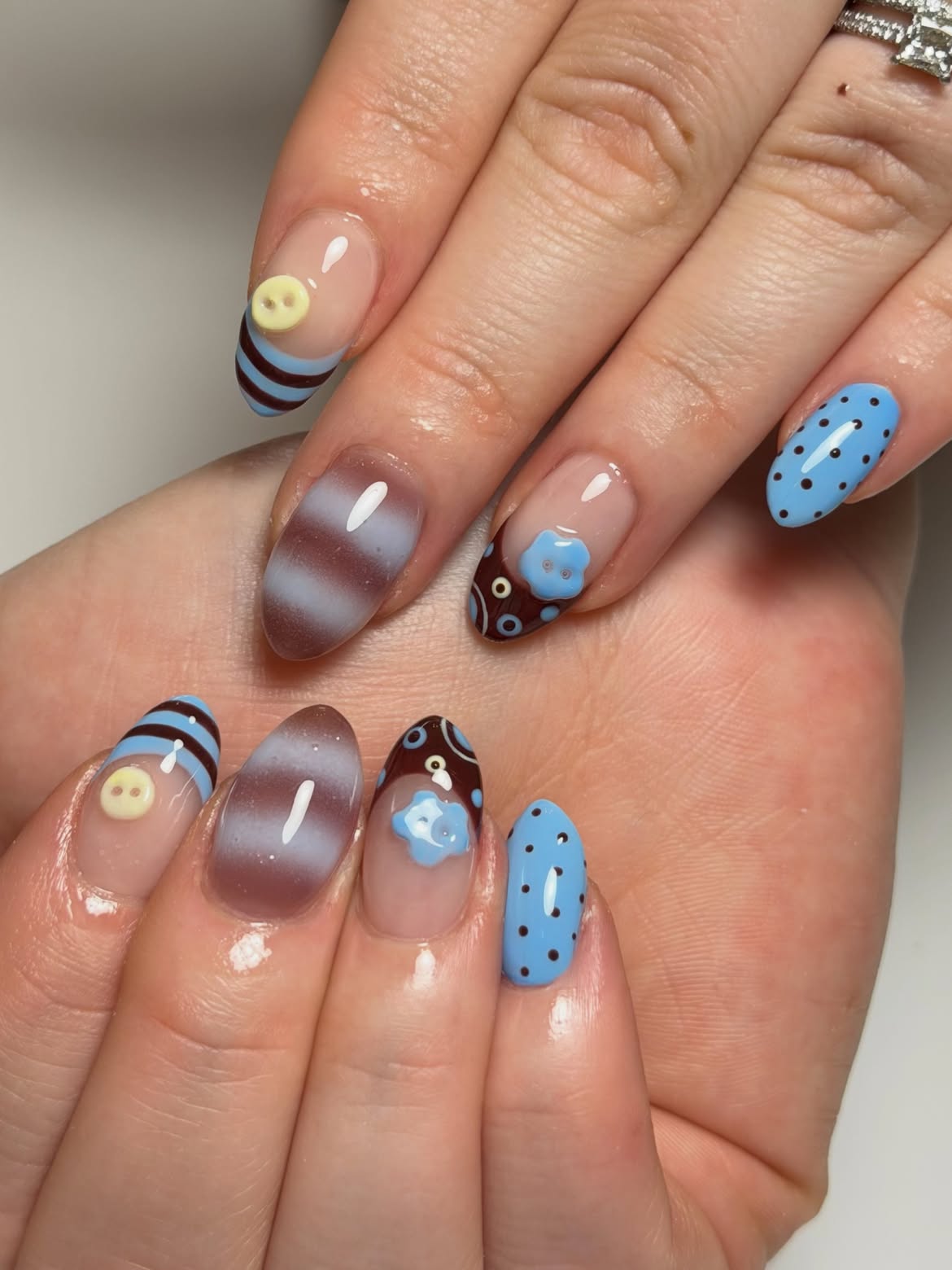 Whimsical Blue Button Flower Oval Nails