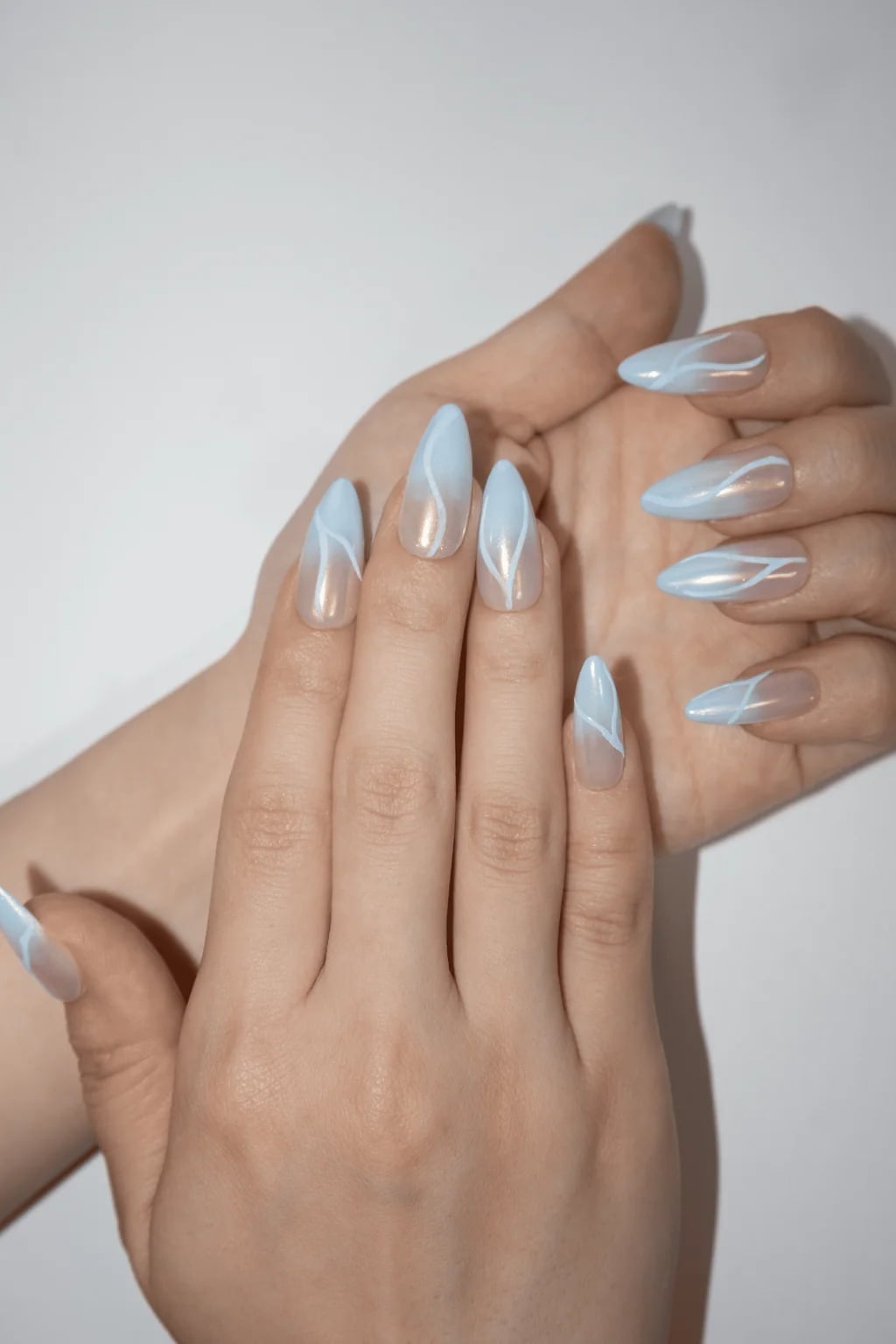 Long Almond Sheer Blue Swirl Lines Long Almond Sheer Blue Swirl Lines — Baby Blue Nails