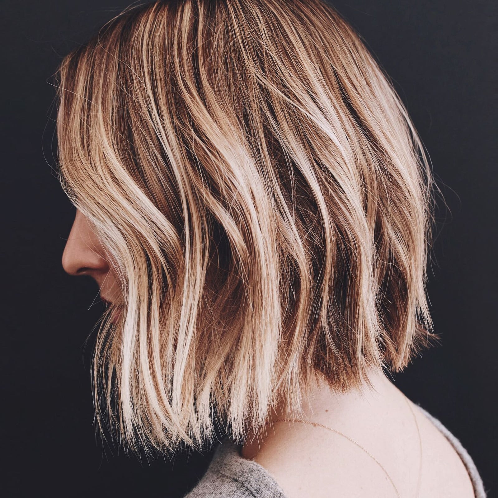 Chin Bob With Blonde Highlights And Side-Swept Bangs, Close-Up Take — Balayage Bob