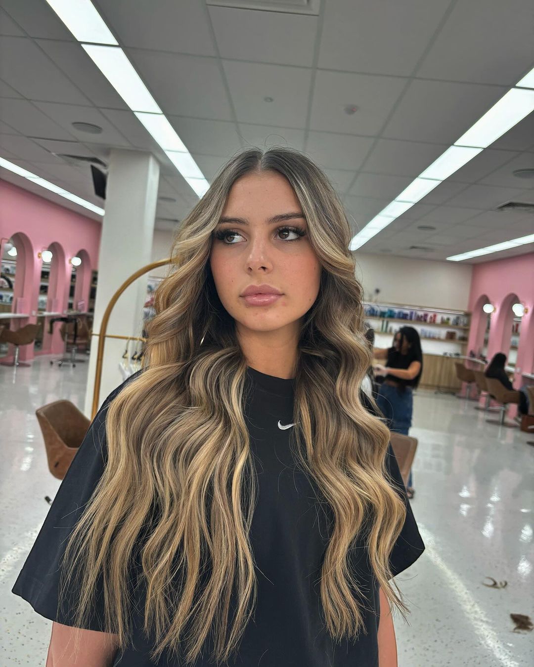 Mid-Back Blonde Balayage With Curtain Bangs and Parted In The Middle — Balayage Hair Blonde
