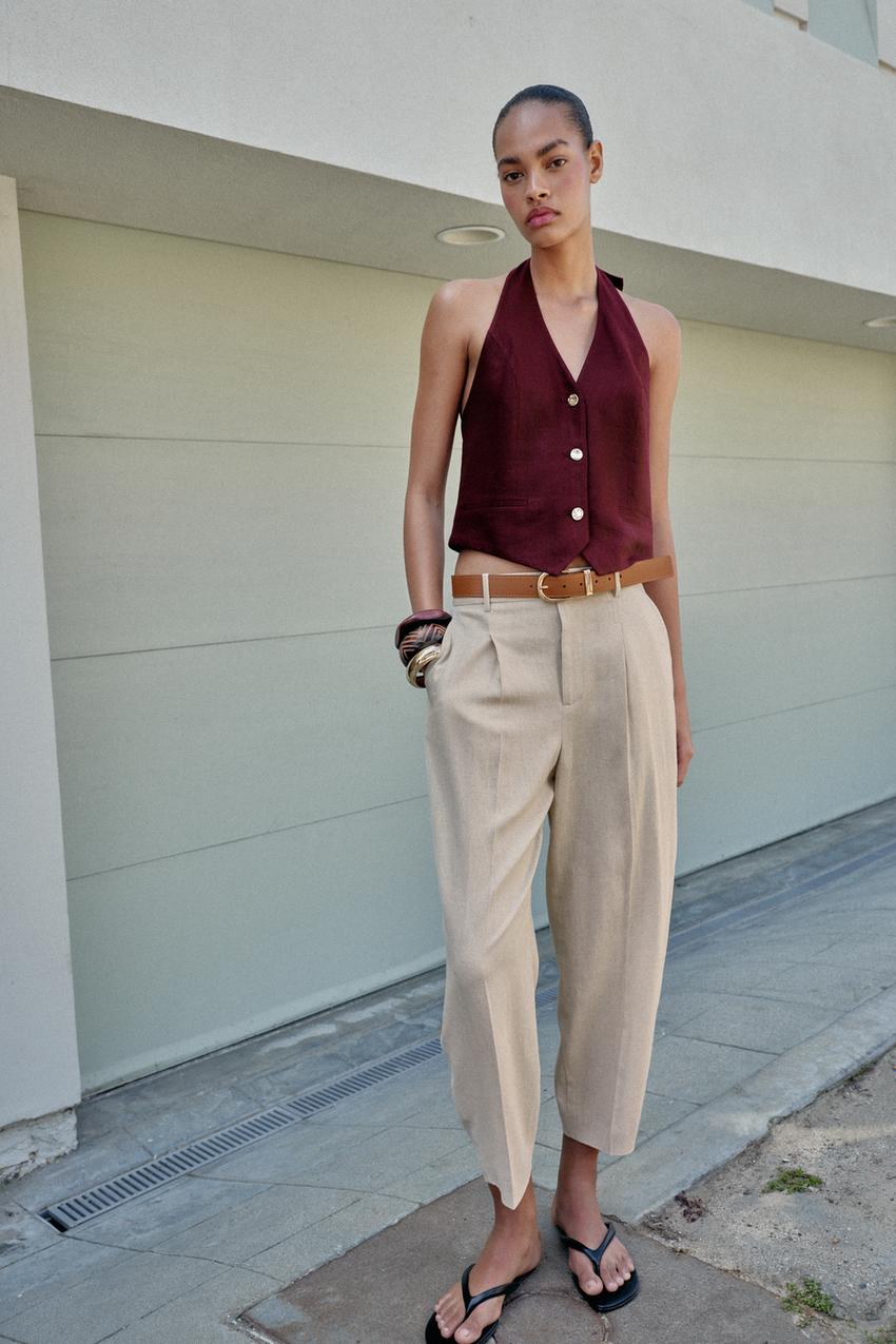 Beige Pleated Trousers With Burgundy Vest and Tapered Leg — Beige Pants Outfits