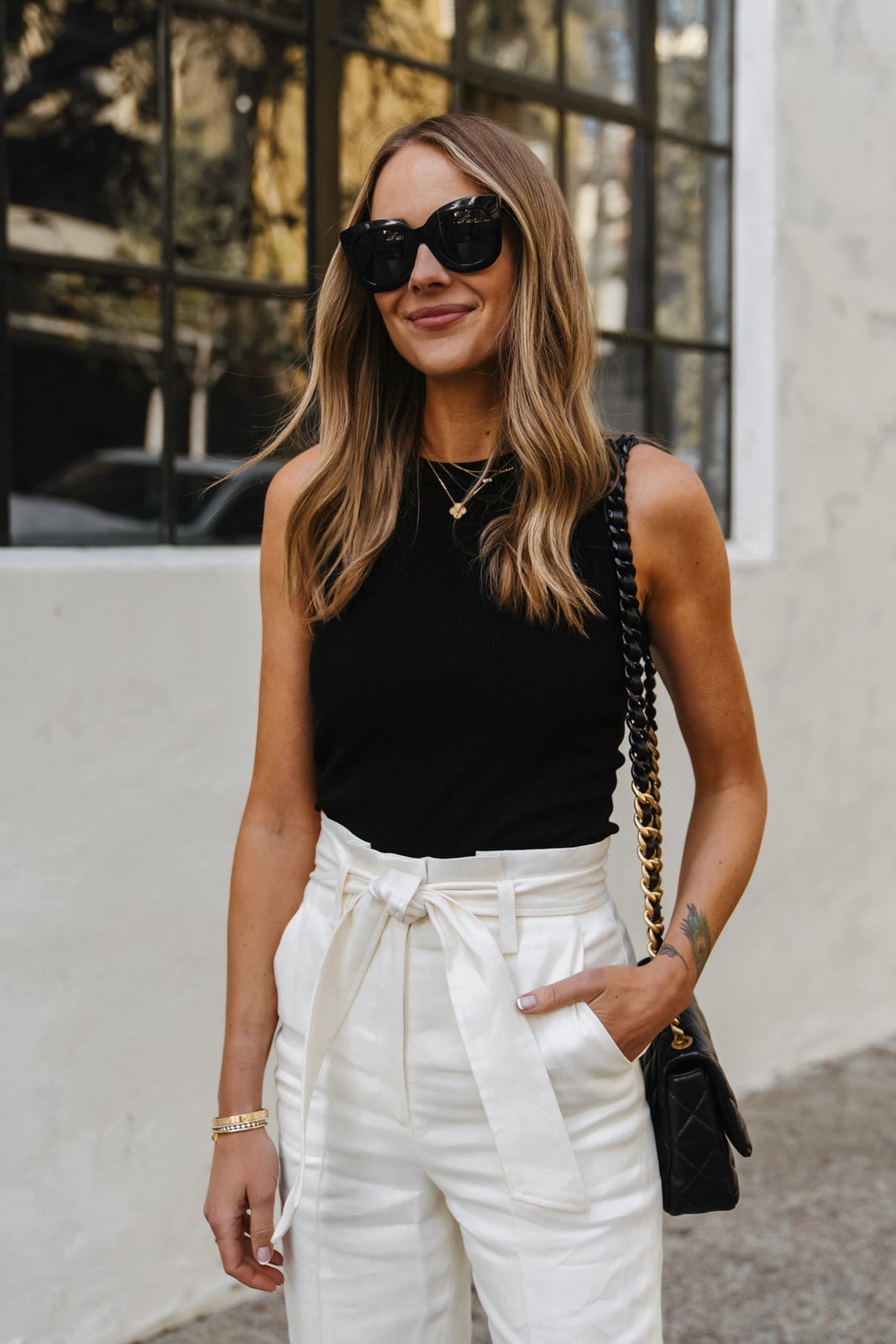 A Black Blazer Over a Black Tank with White Wide-Leg Jeans A Black Blazer Over a Black Tank with White Wide-Leg Jeans — Black and White Outfits