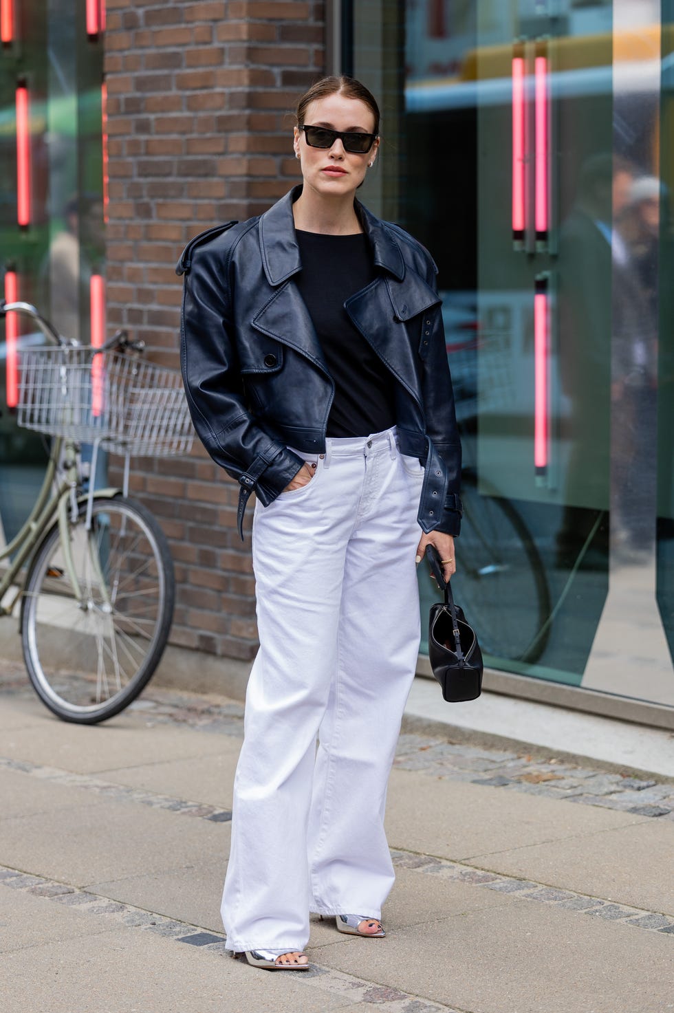 An Oversized Leather Jacket Over a Black Tee and White, Close-Up Take An Oversized Leather Jacket Over a Black Tee and White, Close-Up Take — Black and White Outfits
