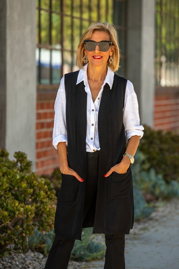 A Black Knit Vest Over a White Shirt with Black Trousers A Black Knit Vest Over a White Shirt with Black Trousers — Black and White Outfits