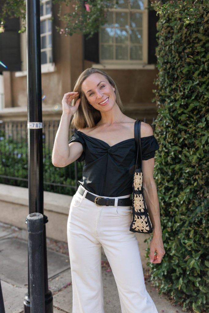 A Black Off-The-Shoulder Top with White High-Waisted, Close-Up Take A Black Off-The-Shoulder Top with White High-Waisted, Close-Up Take — Black and White Outfits