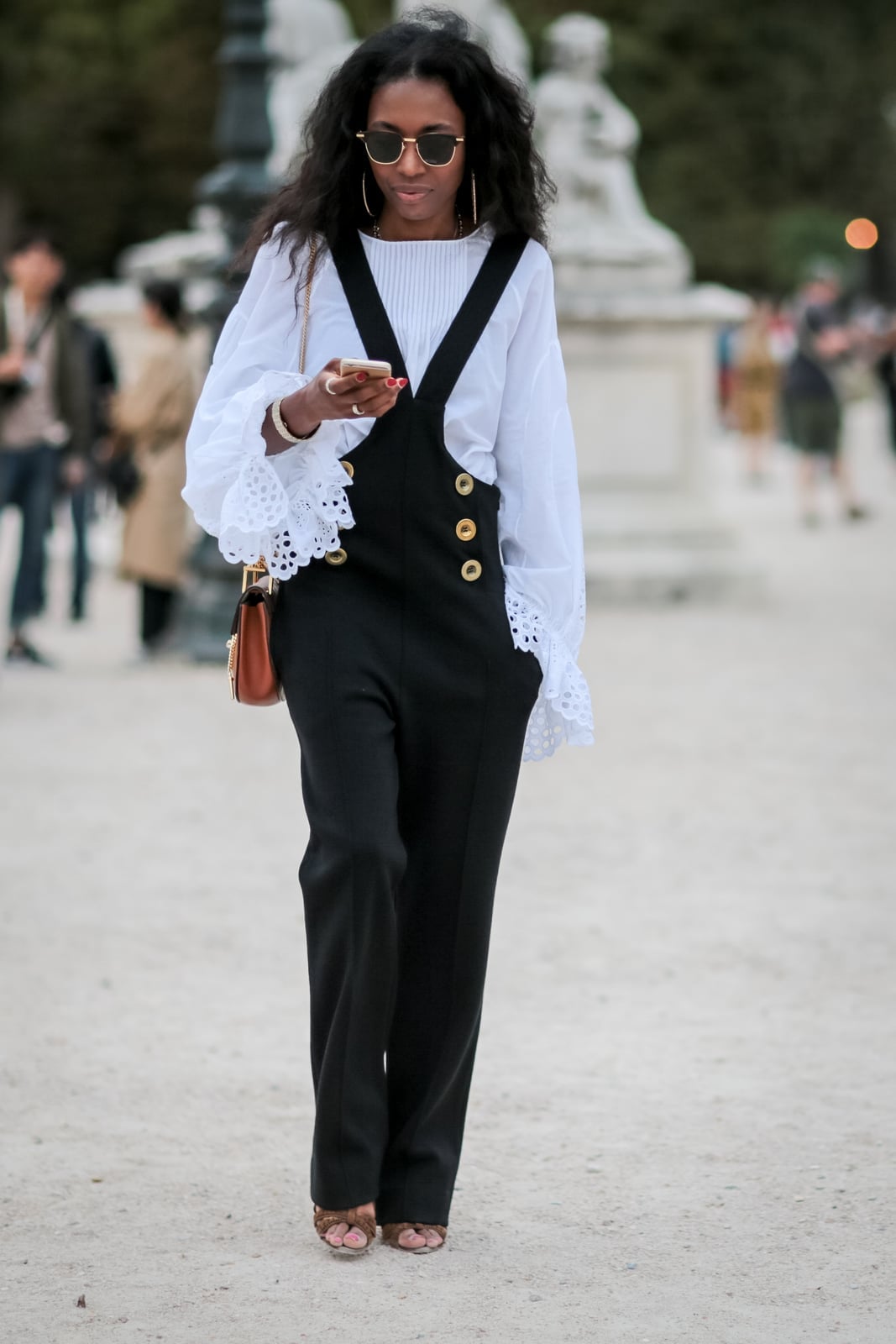 Black Overalls Over a White Blouse with Animal Print, Close-Up Take Black Overalls Over a White Blouse with Animal Print, Close-Up Take — Black and White Outfits
