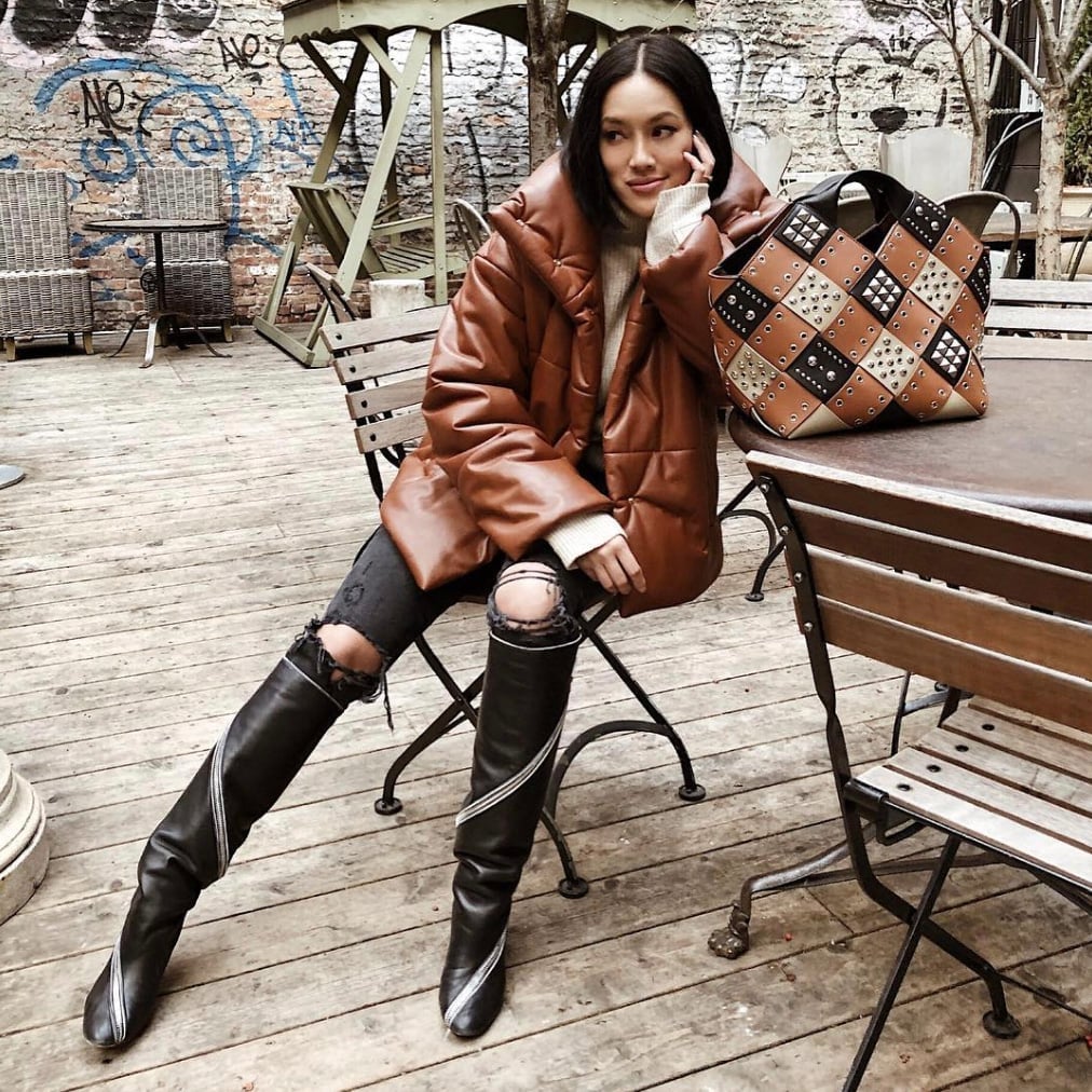 Black Knee-High Boots With Ripped Jeans And Puffer Jacket Black Knee-High Boots With Ripped Jeans And Puffer Jacket — Black Boots Outfit