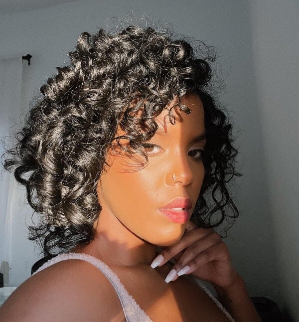 Mid-Back Cascading Curls With Braids and Curtain Bangs Mid-Back Cascading Curls With Braids and Curtain Bangs — Black Curly Hair