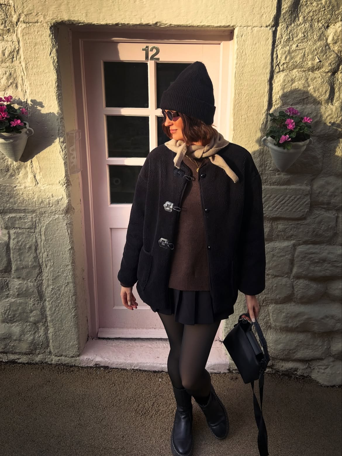Black Fleece Coat And Pleated Skirt Winter Look