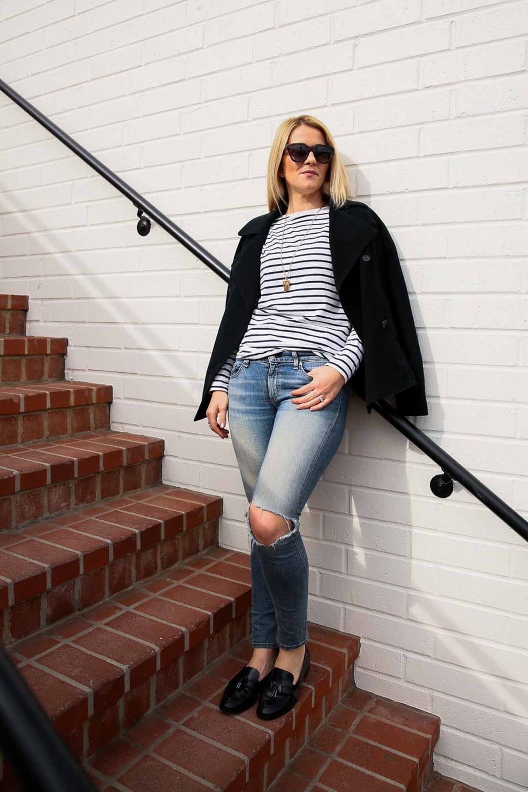 Black Tassel Loafers with Ripped Jeans and Striped Top — Black Loafers Outfit