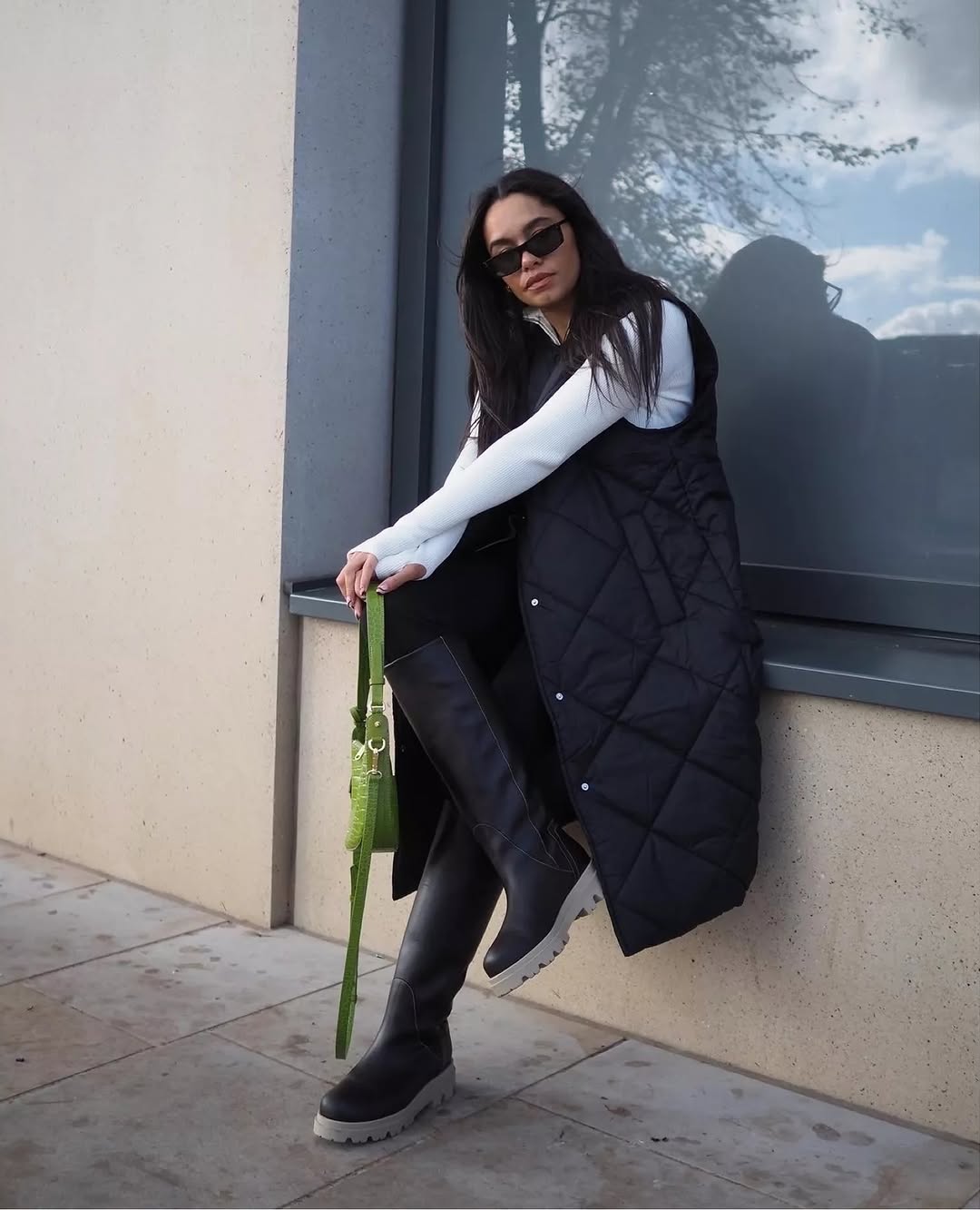 Black Long Puffer Vest With Knee High Boots