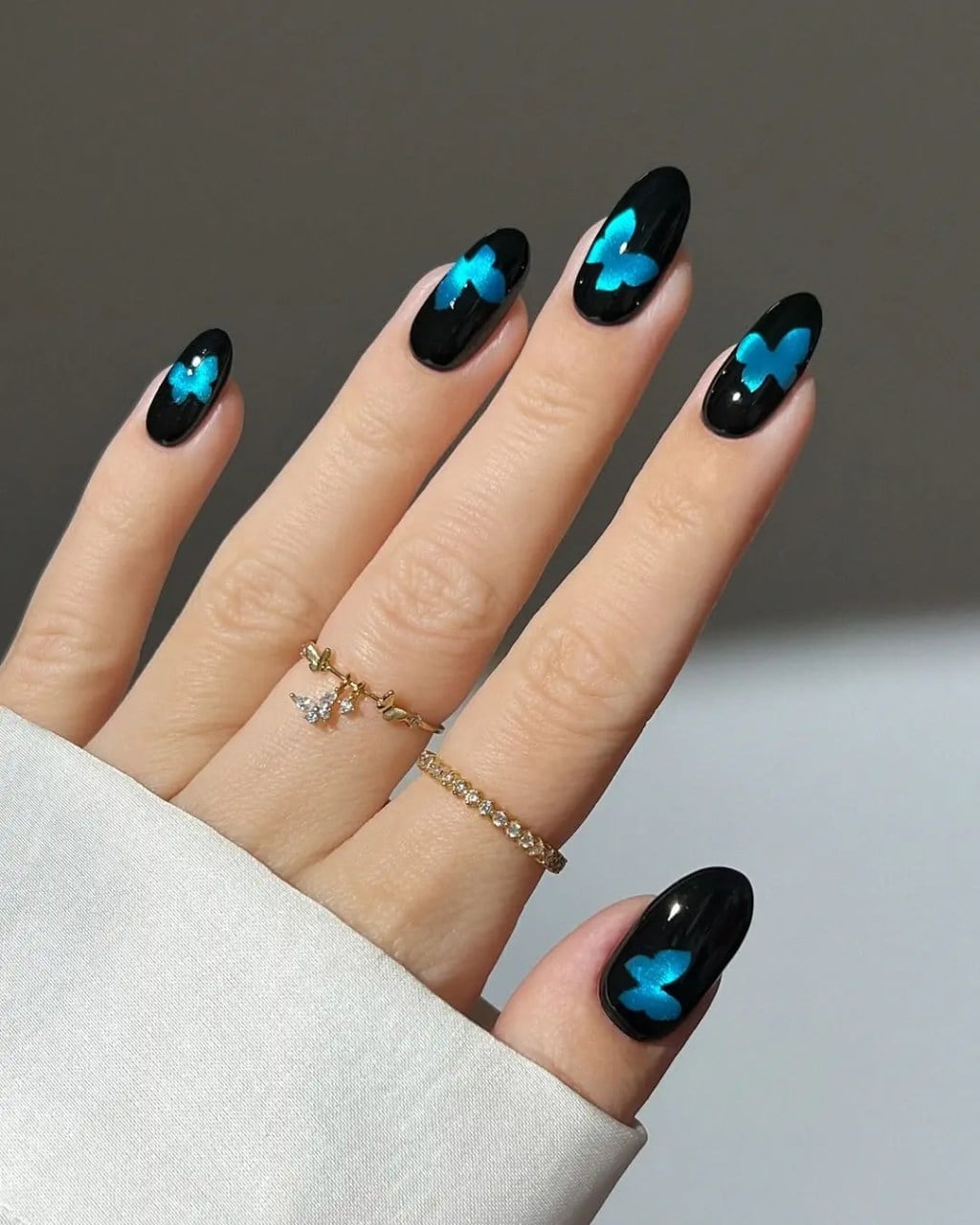 Medium Almond Glossy Black with Blue Butterfly Art Medium Almond Glossy Black with Blue Butterfly Art — Black Nails