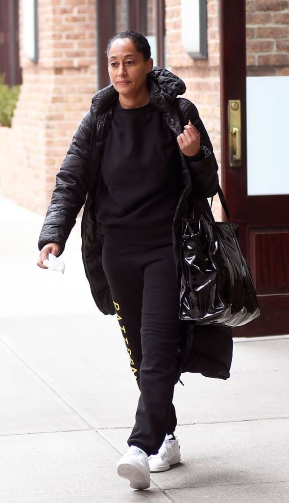 Puffer Coat Over Sweatpants With Yellow Text — Black Sweatpants Outfit