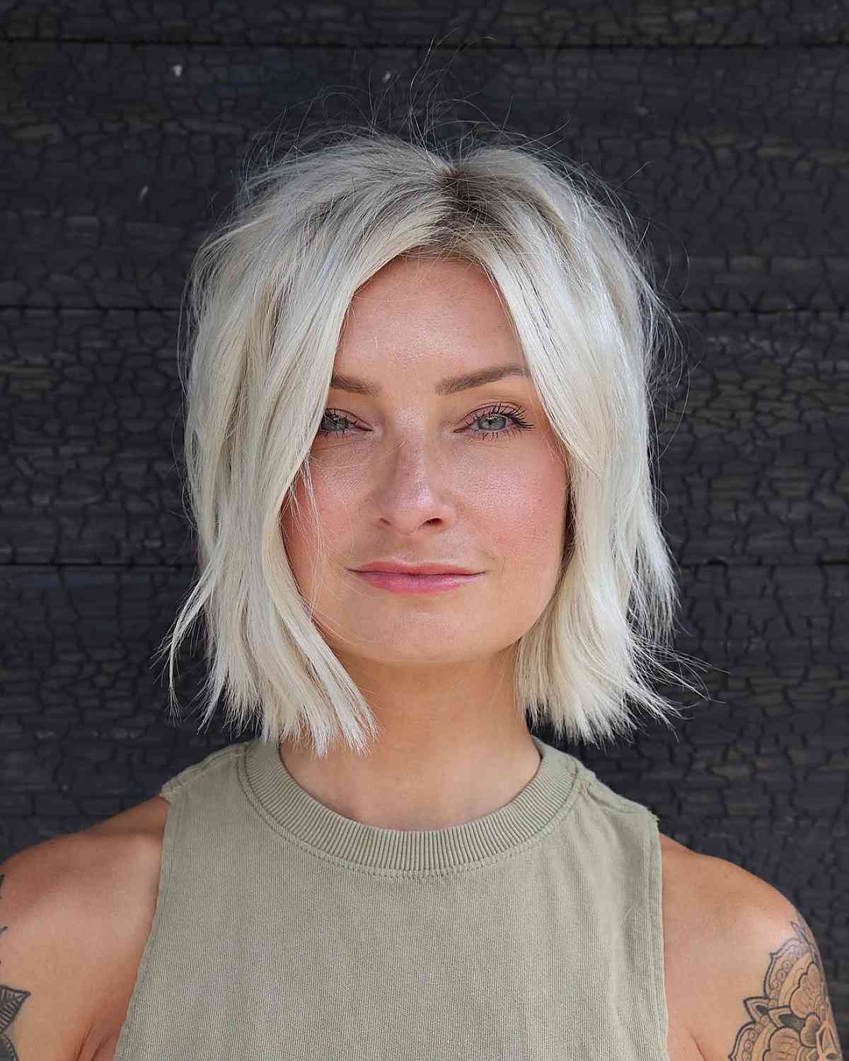 Textured Platinum Bob With Wispy Bangs — Blonde Short Hair
