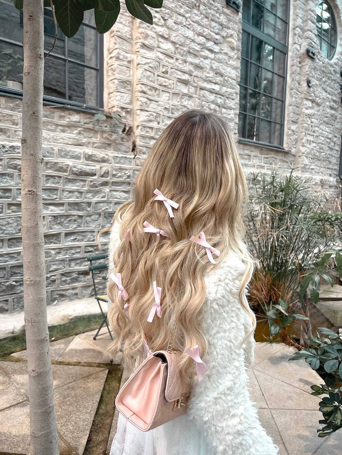 Blonde Waves Adorned With Pink Satin Bows