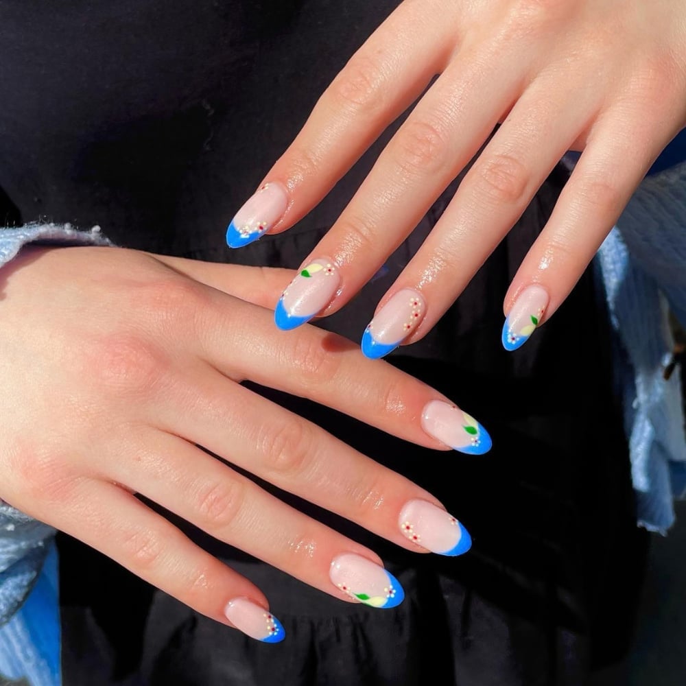 Blue French Tip Floral Accents Medium Almond Nails Blue French Tip Floral Accents Medium Almond Nails — Blue Almond Nails