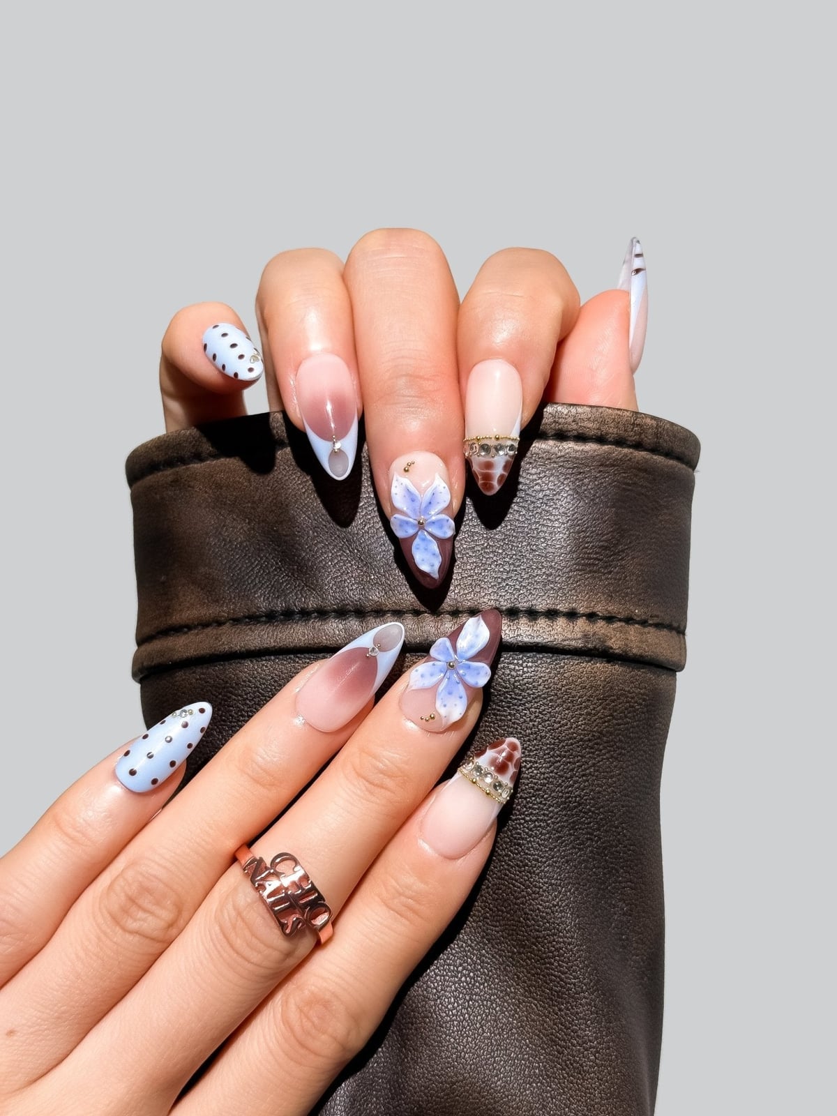 Sheer Nude Base 3D Blue Flower Long Almond Nails Sheer Nude Base 3D Blue Flower Long Almond Nails — Blue Almond Nails