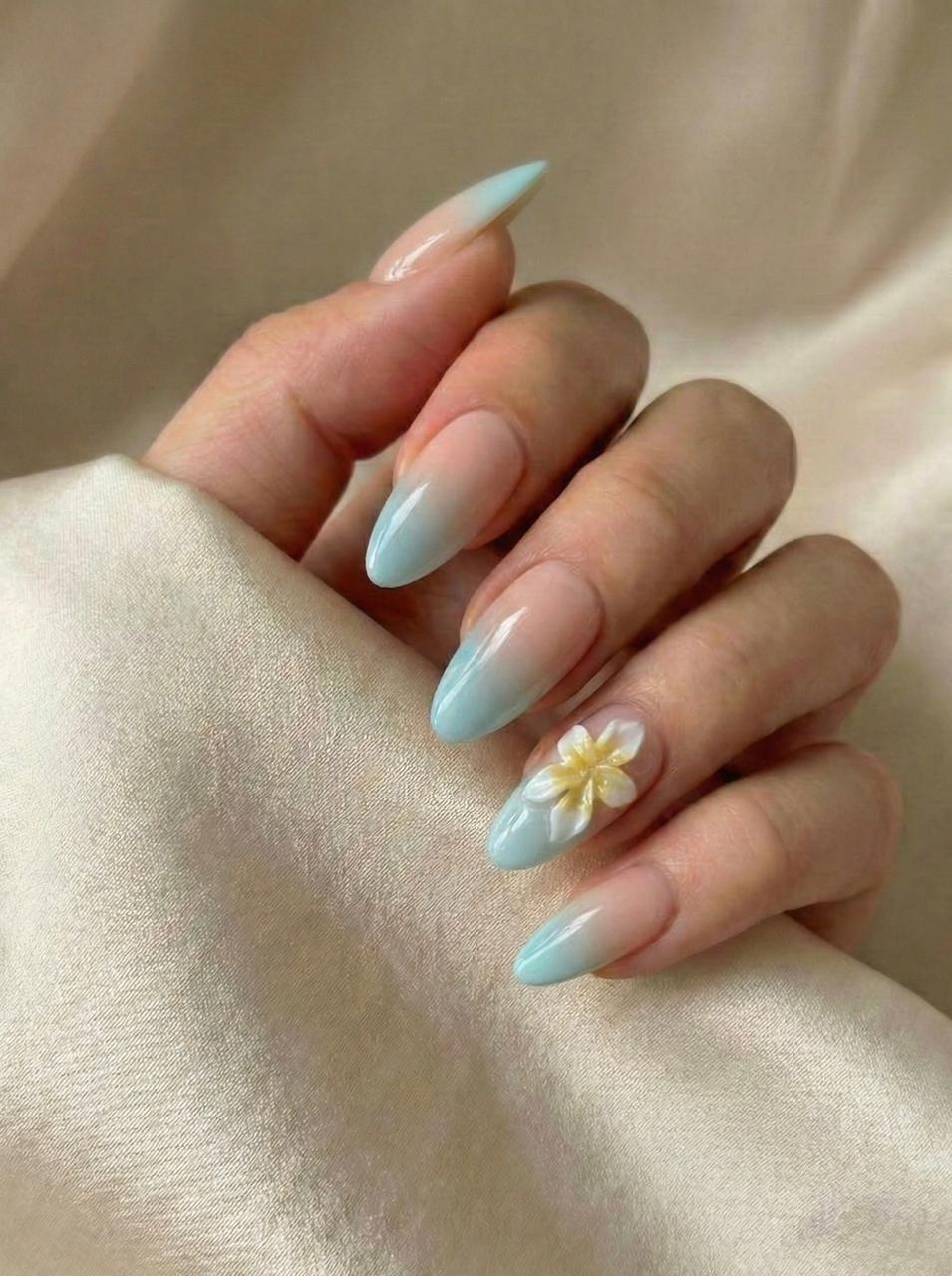Nude To Light Blue Gradient 3D Flower Long Almond Nails Nude To Light Blue Gradient 3D Flower Long Almond Nails — Blue Almond Nails