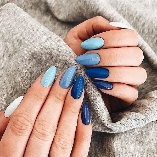 Medium Almond Nails in Various Blues with Silver Bow Charms Medium Almond Nails in Various Blues with Silver Bow Charms — Blue Nails