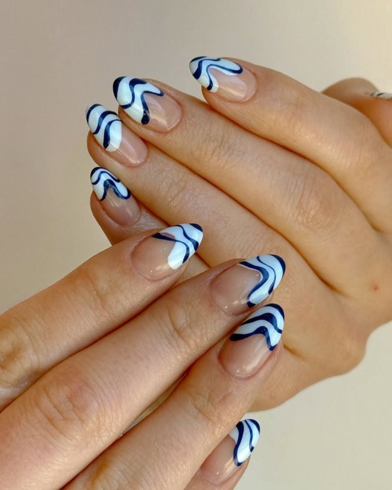 Medium Almond Sheer Nude with Wavy Blue and White Lines Medium Almond Sheer Nude with Wavy Blue and White Lines — Blue Nails