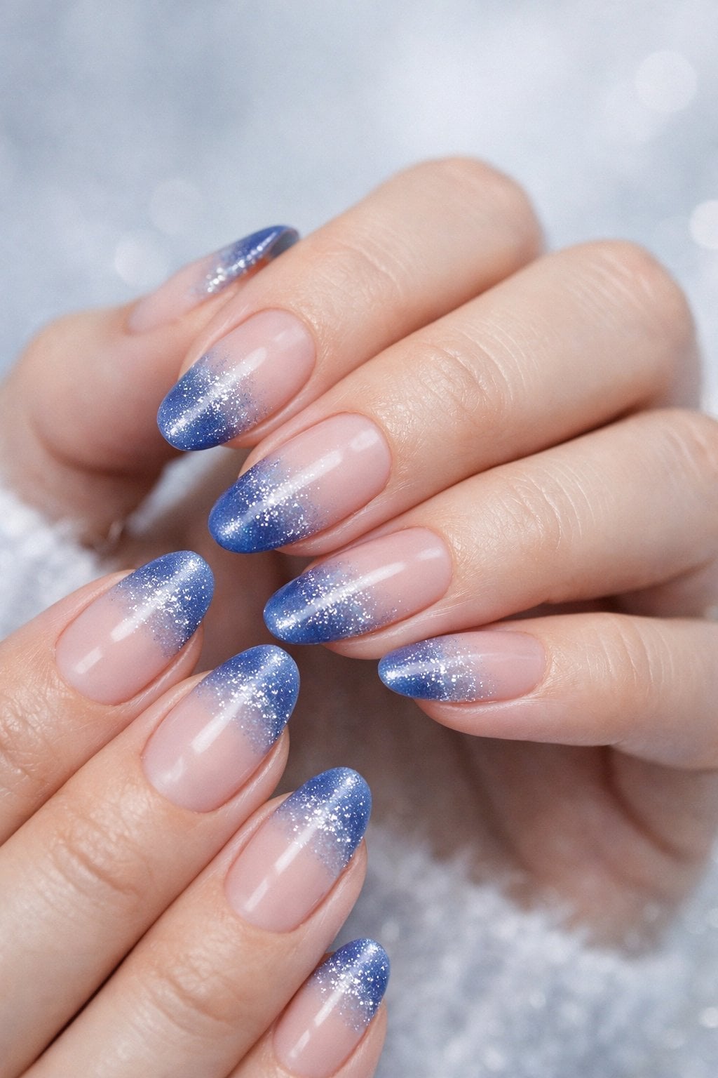 Medium Almond Nude to Blue Glitter Gradient, Close-Up Take Medium Almond Nude to Blue Glitter Gradient, Close-Up Take — Blue Winter Nails