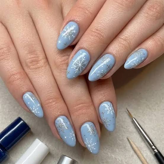 Matte Light Blue Oval Nails with Snowflakes Matte Light Blue Oval Nails with Snowflakes — Blue Winter Nails