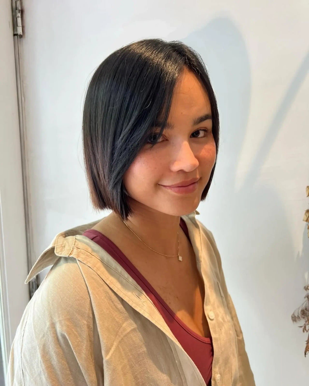 Dark Brown Chin Length Bob Tucked, Close-Up Take — Blunt Bob