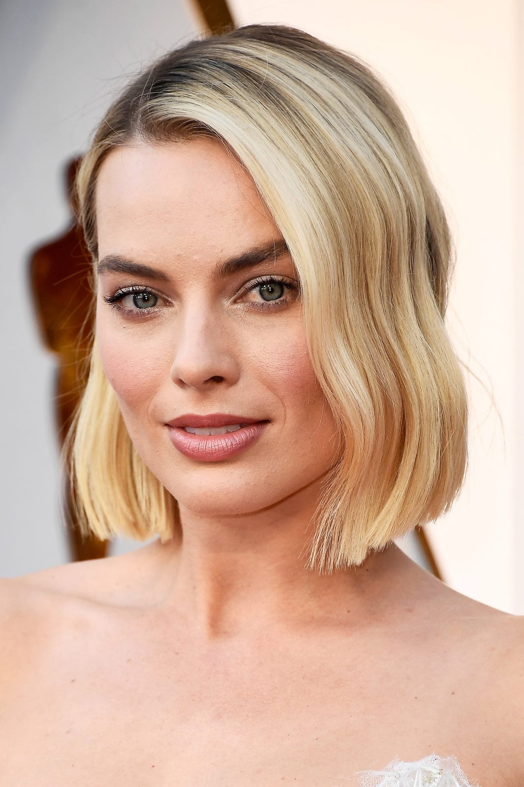 Blonde Chin Bob With Glossy Waves — Bob Haircuts