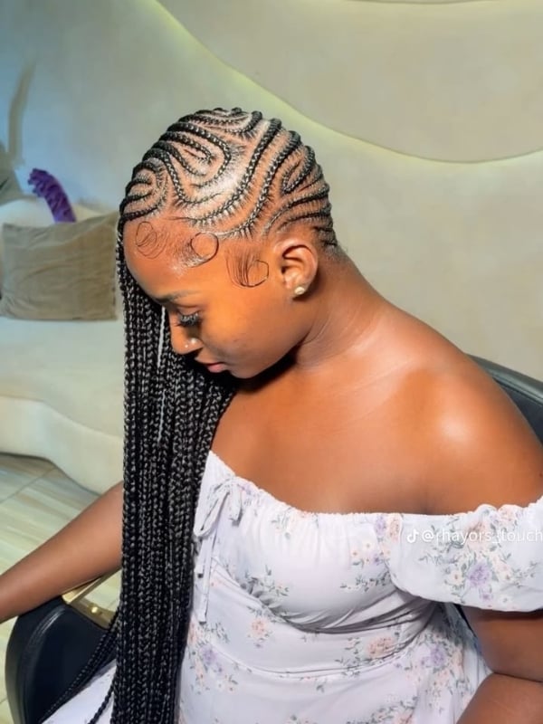 Mid-Back Black Cornrows Swirl Pattern Mid-Back Black Cornrows Swirl Pattern — Braids to the Side