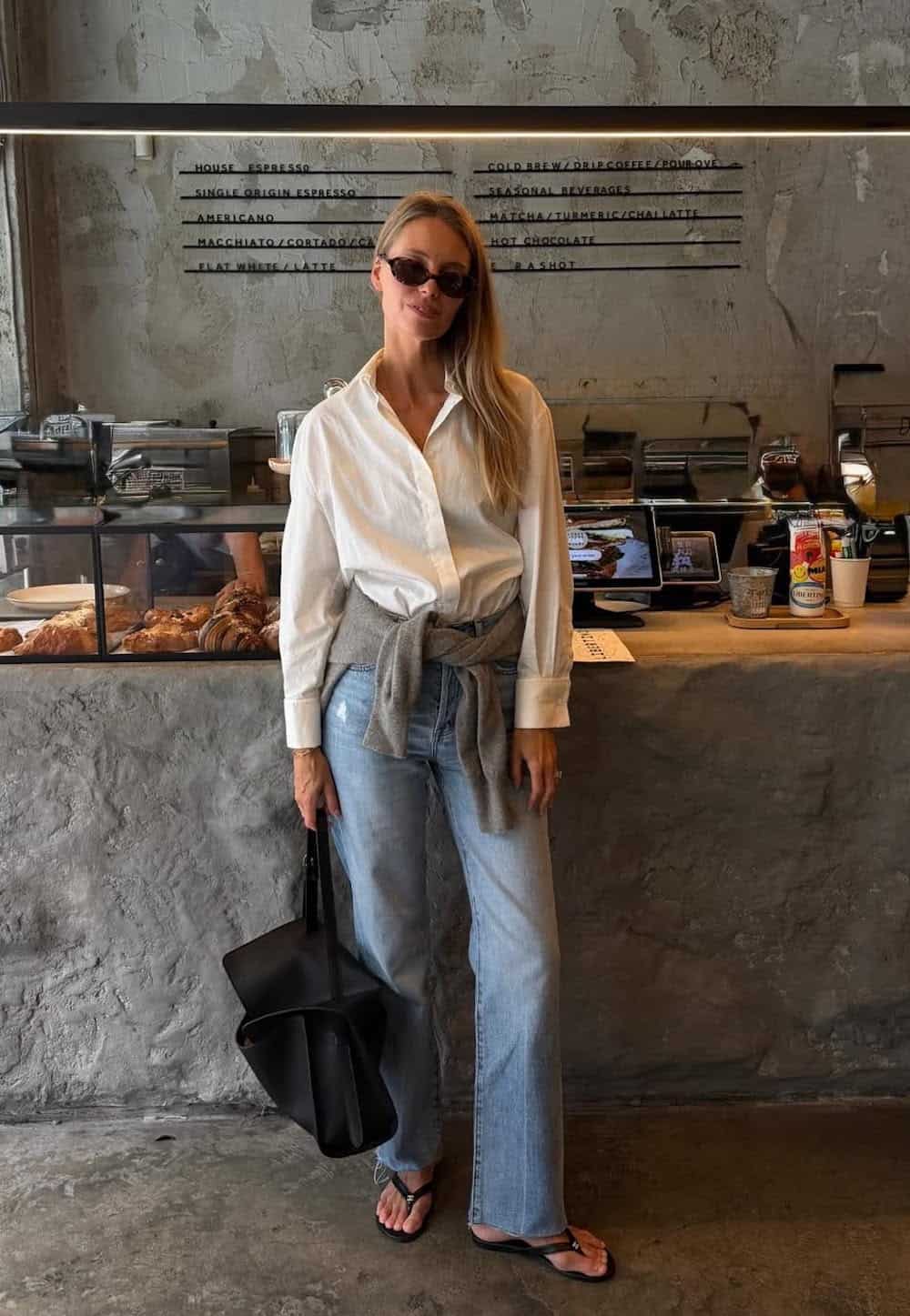 Oversized White Button-Down with Gray Sweater and Light Wash Jeans — Brewery Outfits