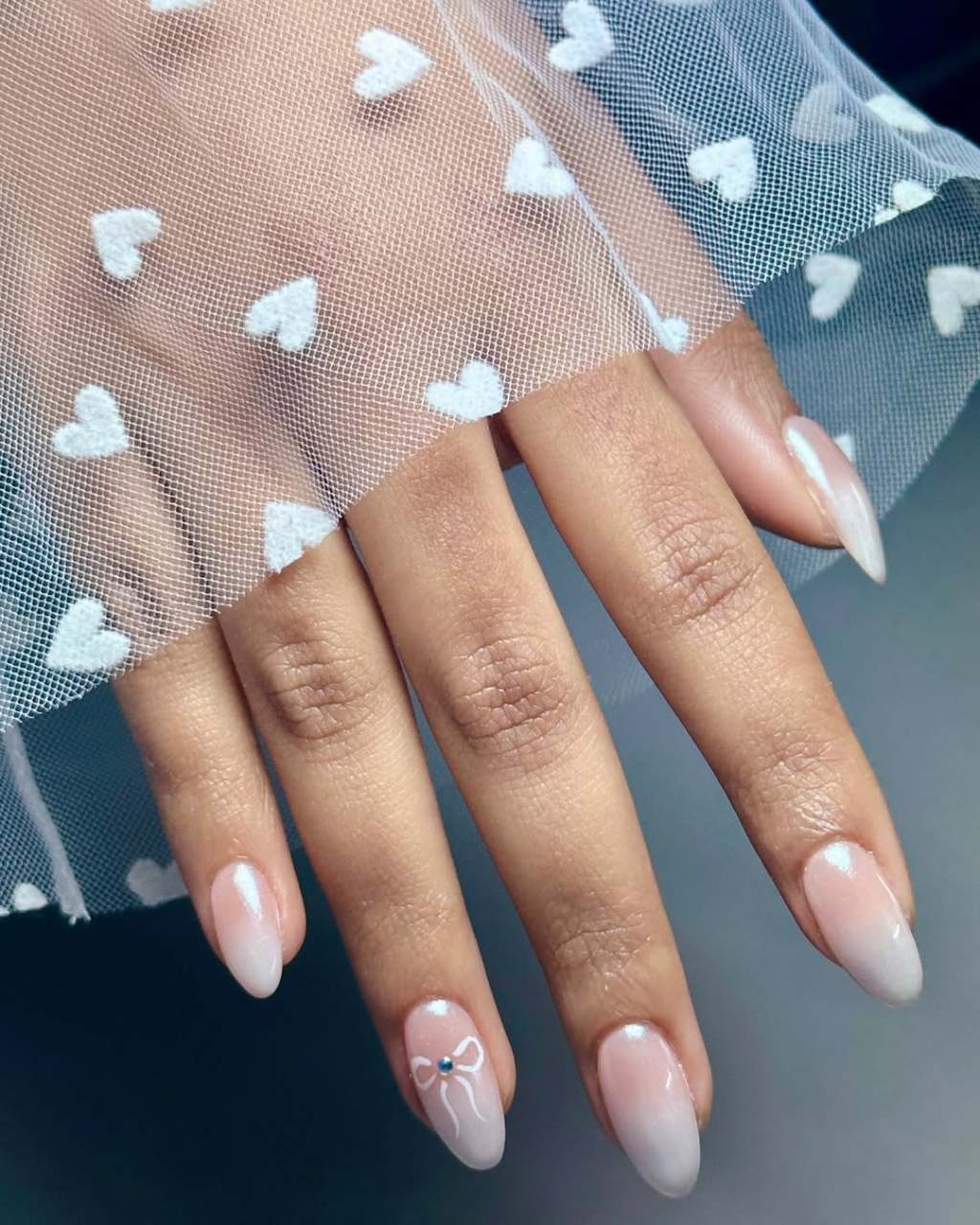 Bow Accent Sheer Pinkish White Medium Oval Nails — Bridal Nails