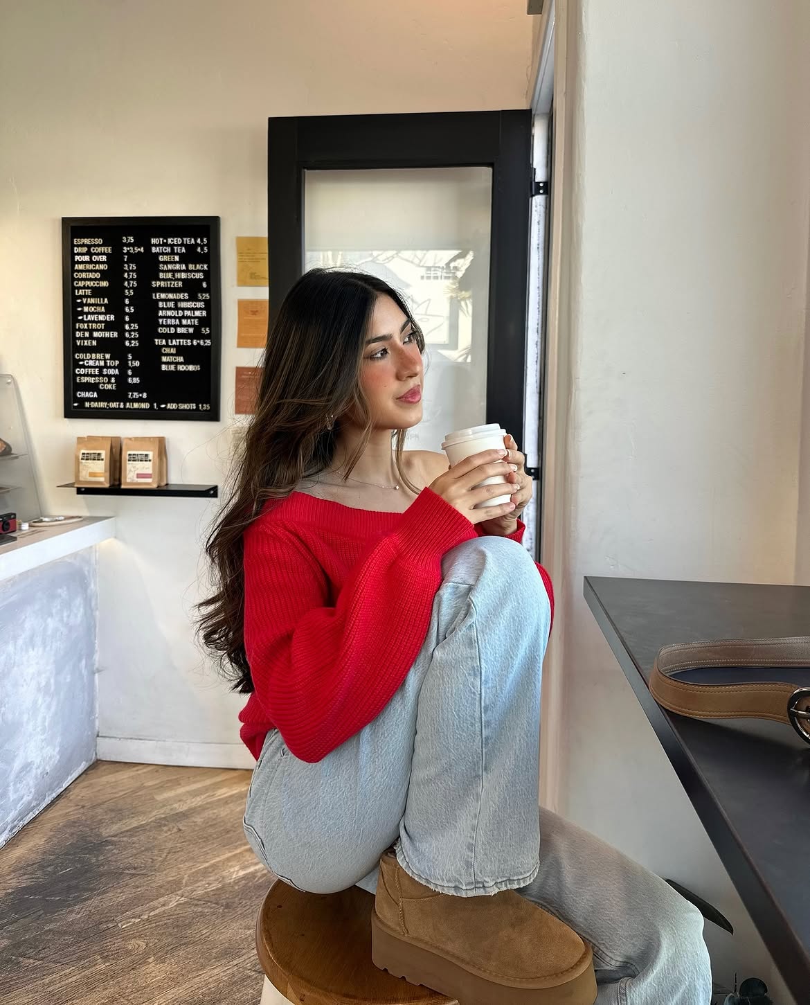 Bright Red Off-Shoulder Sweater With Light Wash Jeans