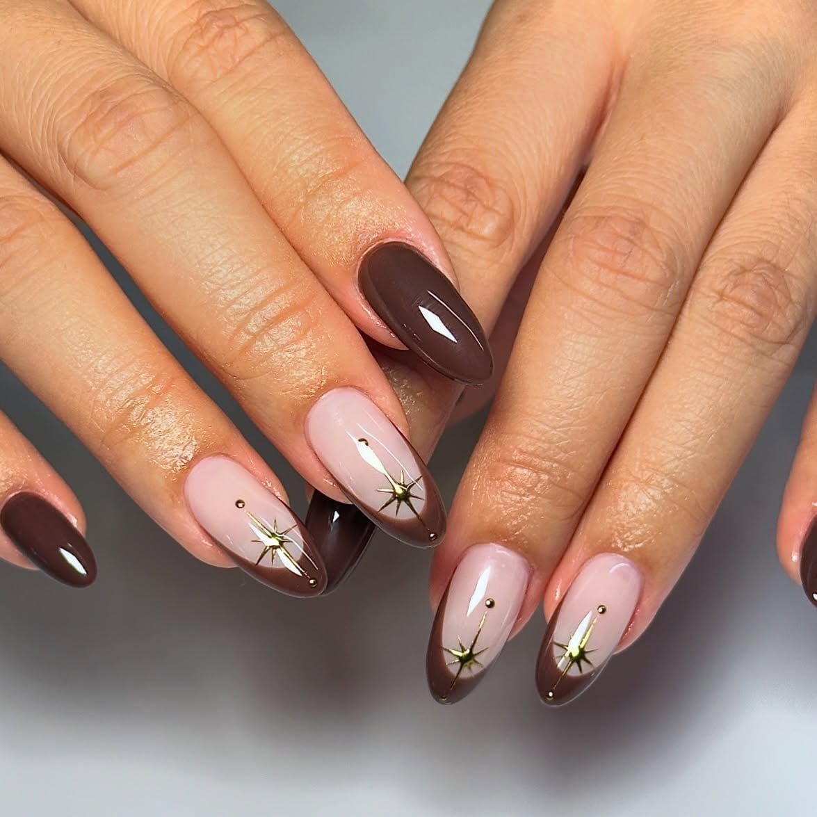 Sheer Pink Almond Nails with Gold Star Accents Sheer Pink Almond Nails with Gold Star Accents — Brown Almond Nails
