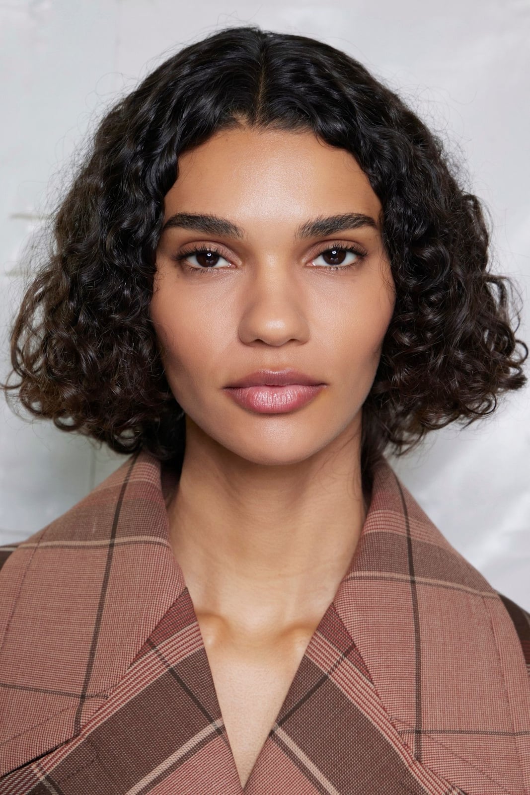 Textured Ear Length Dark Brown Layers — Brown Curly Hair
