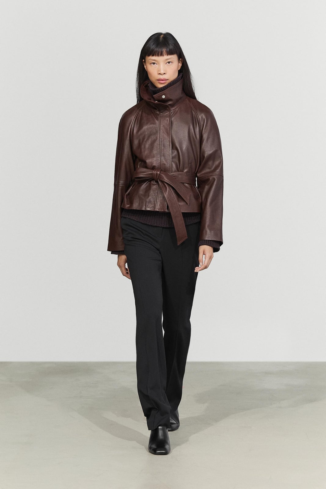Brown Leather Jacket Cinched with Belt Over Black Trousers — Brown Leather Jacket Outfit