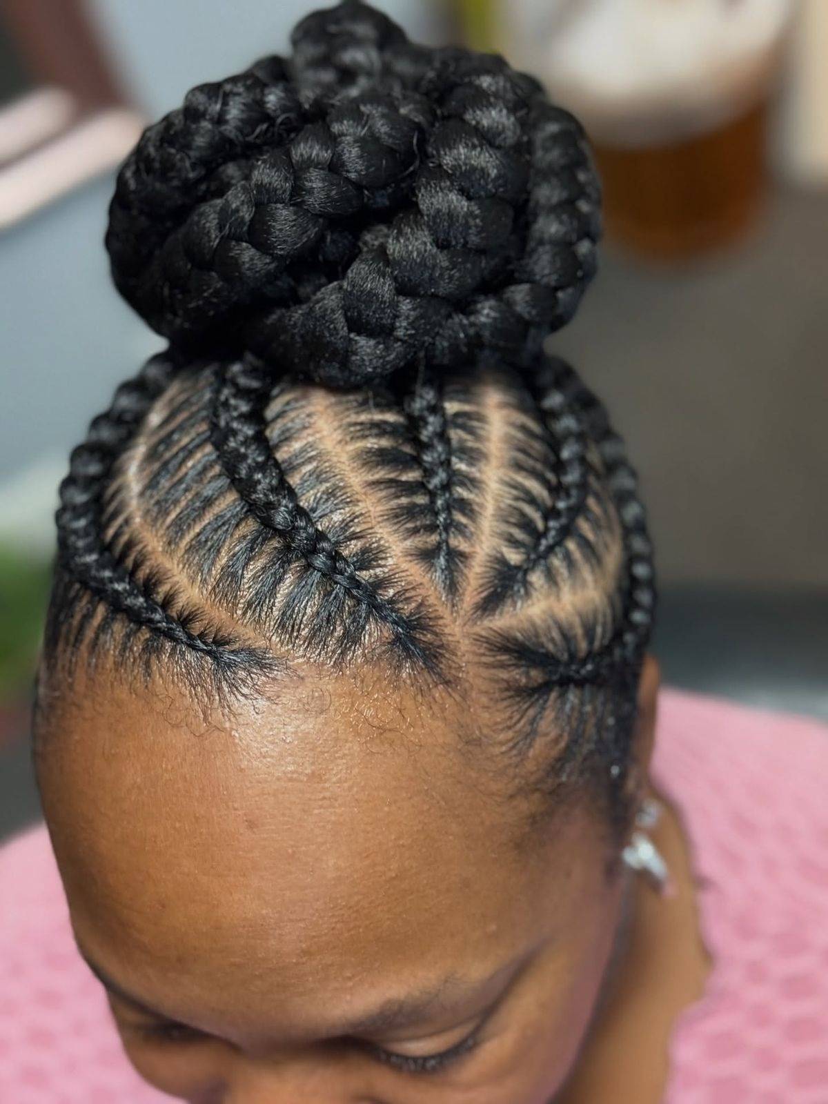 High Bun With Intricate Cornrows Top View High Bun With Intricate Cornrows Top View — Bun Braids