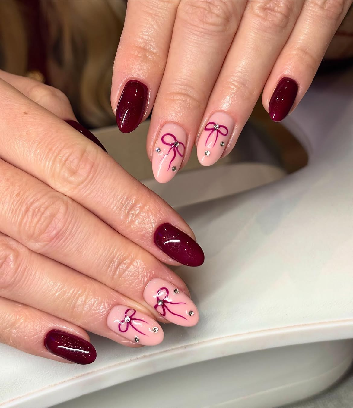 Burgundy and Pink Bow Almond Nails