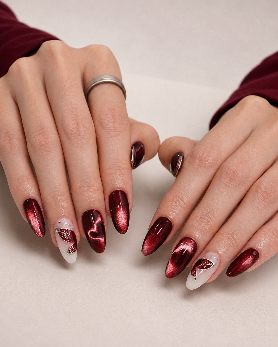 Almond Cat-Eye Chrome with Butterfly Decals, Close-Up Take Almond Cat-Eye Chrome with Butterfly Decals, Close-Up Take — Burgundy Chrome Nails