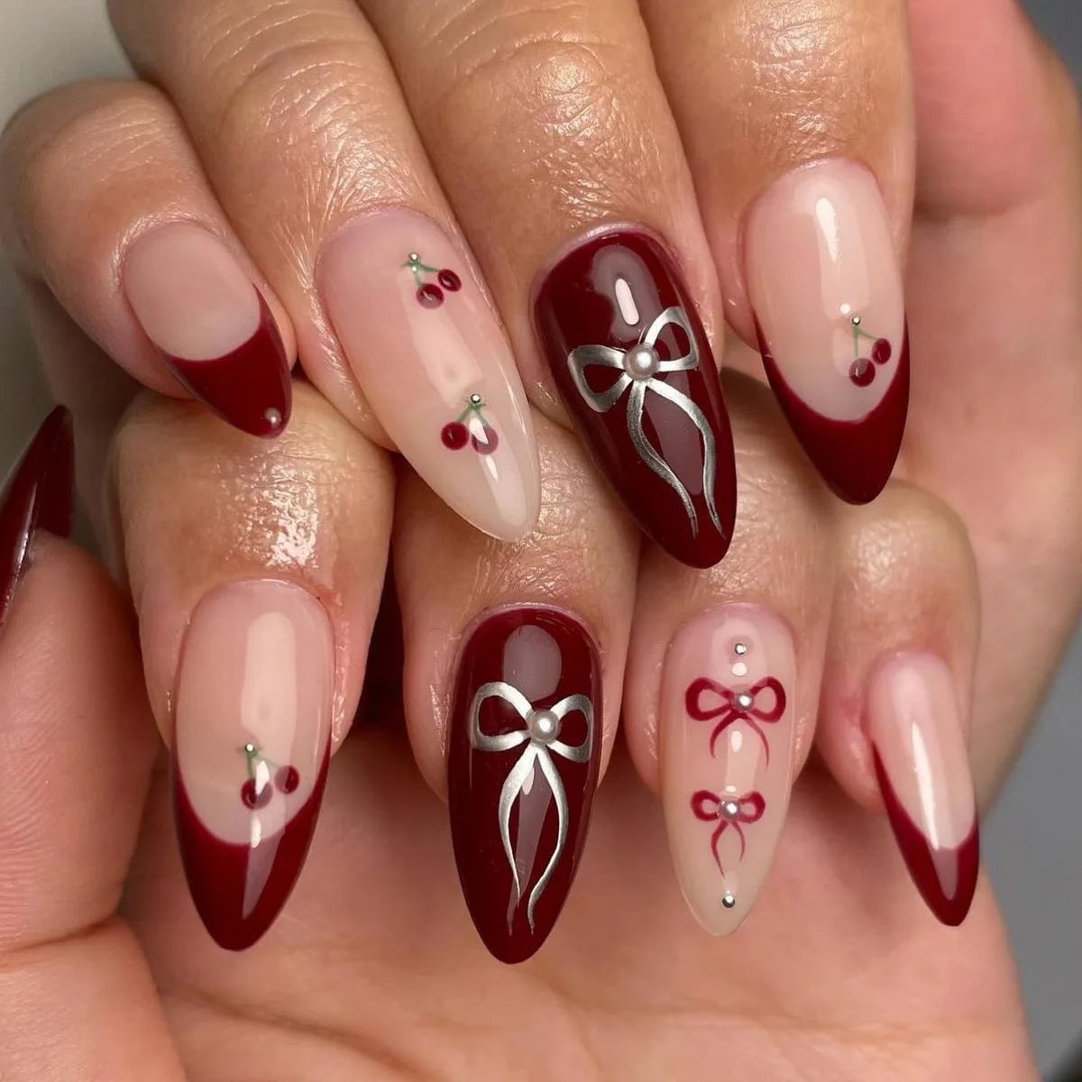 Almond Nails With Burgundy Tips Cherries And Silver Bows — Burgundy Nails Art