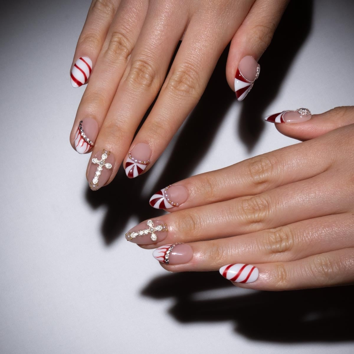 Nude Base Medium Almond Candy Cane Rhinestone Nails Nude Base Medium Almond Candy Cane Rhinestone Nails — Candy Cane Nails