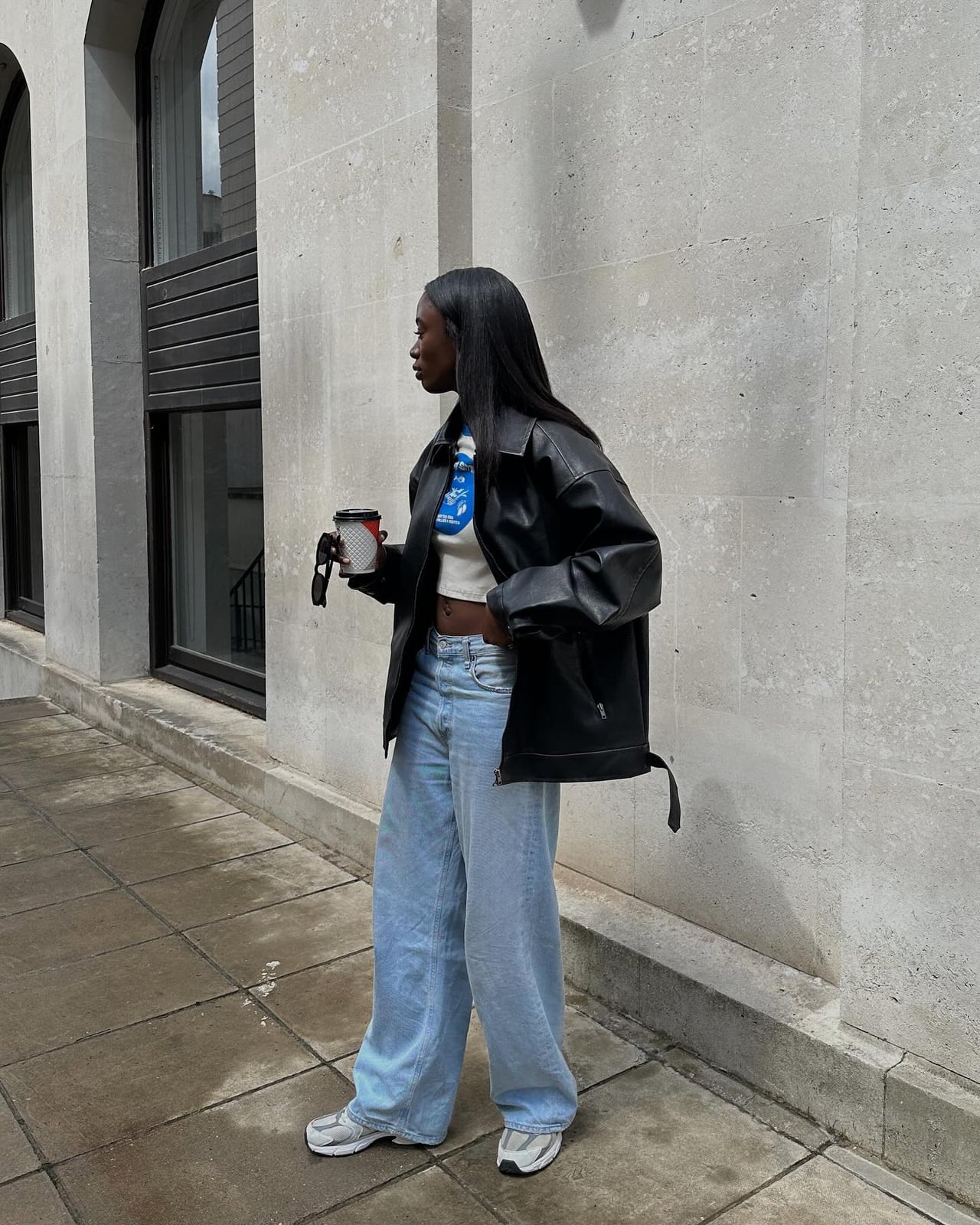 Leather Jacket Over White Crop Top and Wide Jeans Leather Jacket Over White Crop Top and Wide Jeans — Casual Concert Outfit