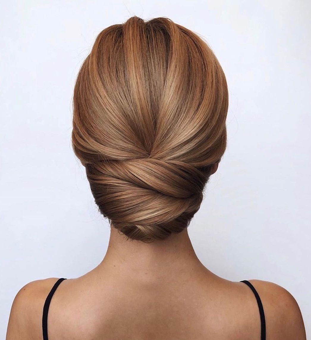 Sculpted Honey Blonde Low Twisted Bun — Casual Updo