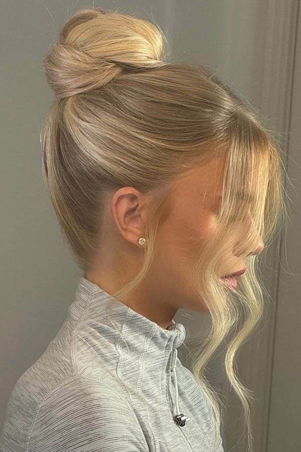 Platinum Blonde High Bun Curtain Bangs — Casual Updo