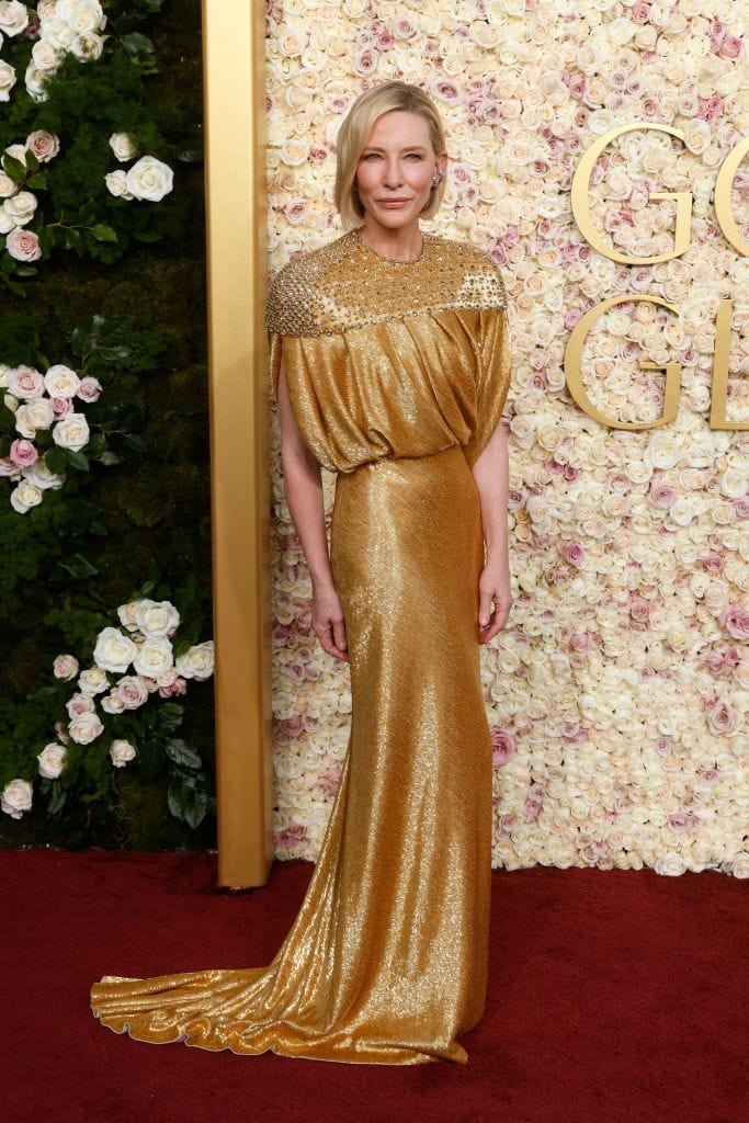 Gold Metallic Gown with Draped Cape Sleeves — Celebrities Dresses