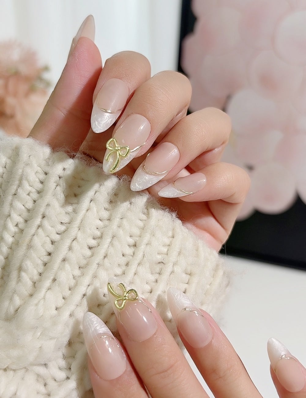 Sheer Nude White French Gold Line Gold Bow Stiletto Almond Nails Sheer Nude White French Gold Line Gold Bow Stiletto Almond Nails — Champagne Nails